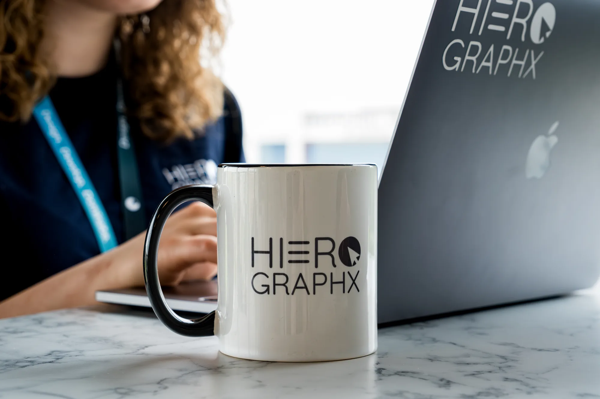 Hiero branded mug and laptop
